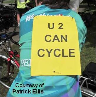 "U2 can cycle" on cyclist's back.